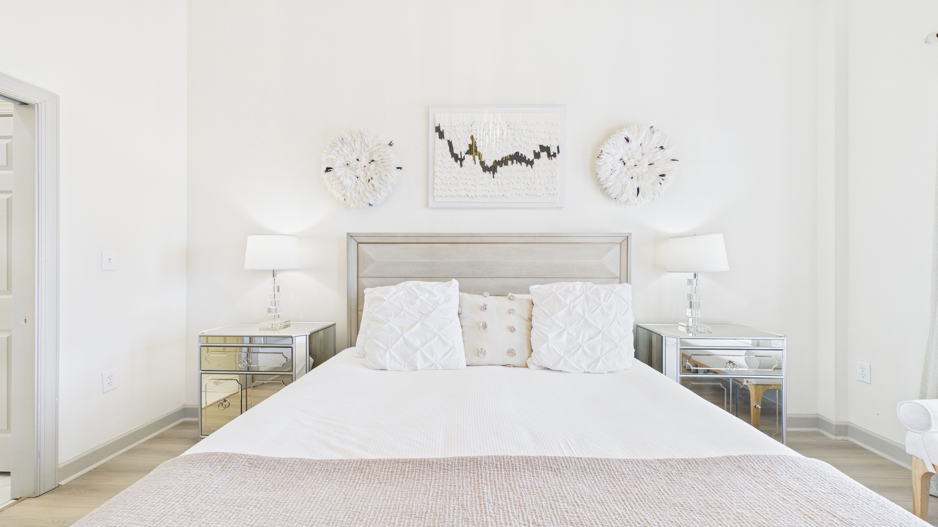 Master bedroom with king size bed and tv screen