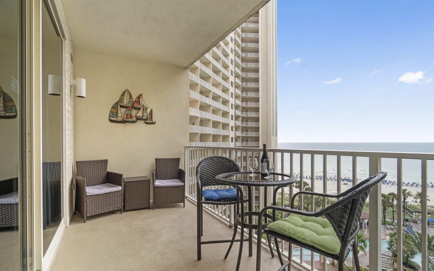 Balcony with comfortable living and dining seating.