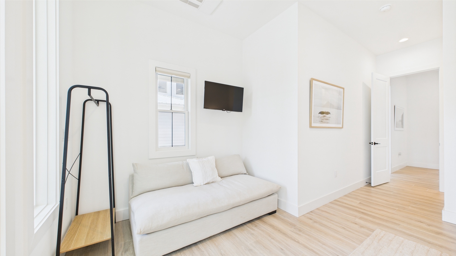Master bedroom with king bed TV and ensuite bathroom