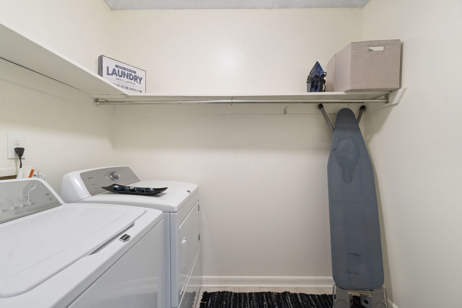 Laundry room with washer and dryer machines