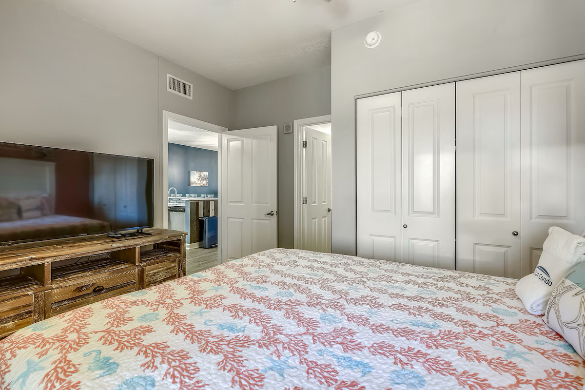 Second guest bedroom with queen bed TV and ensuite bathroom