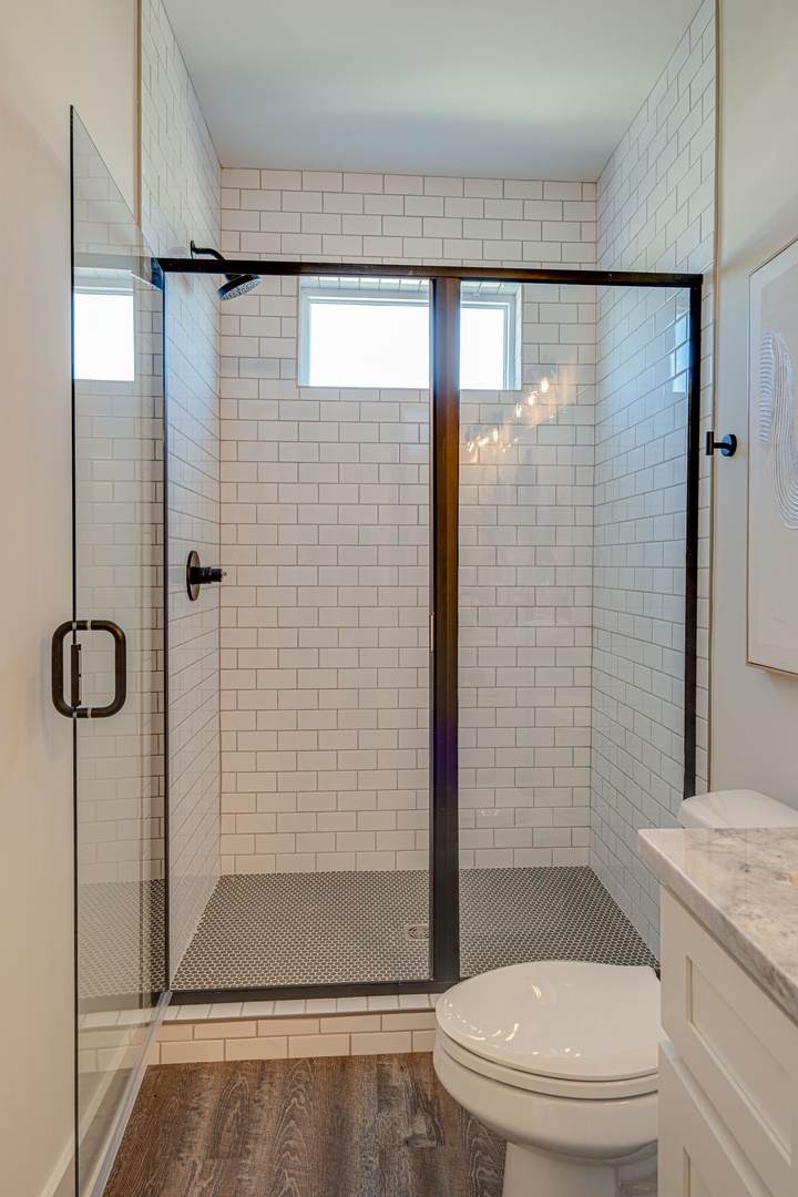 Primary Bathroom featuring a dual vanity and stand-in shower.