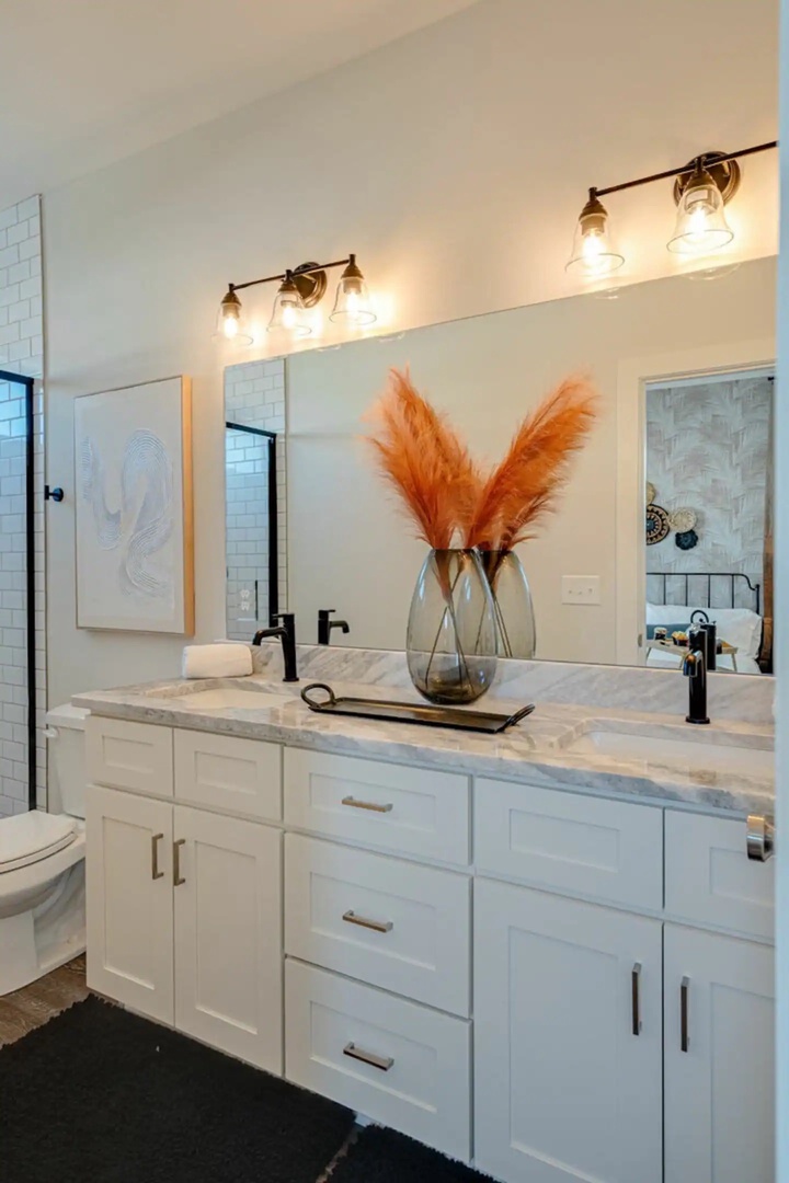 5631 - Primary Bathroom featuring a dual vanity and stand-in shower.