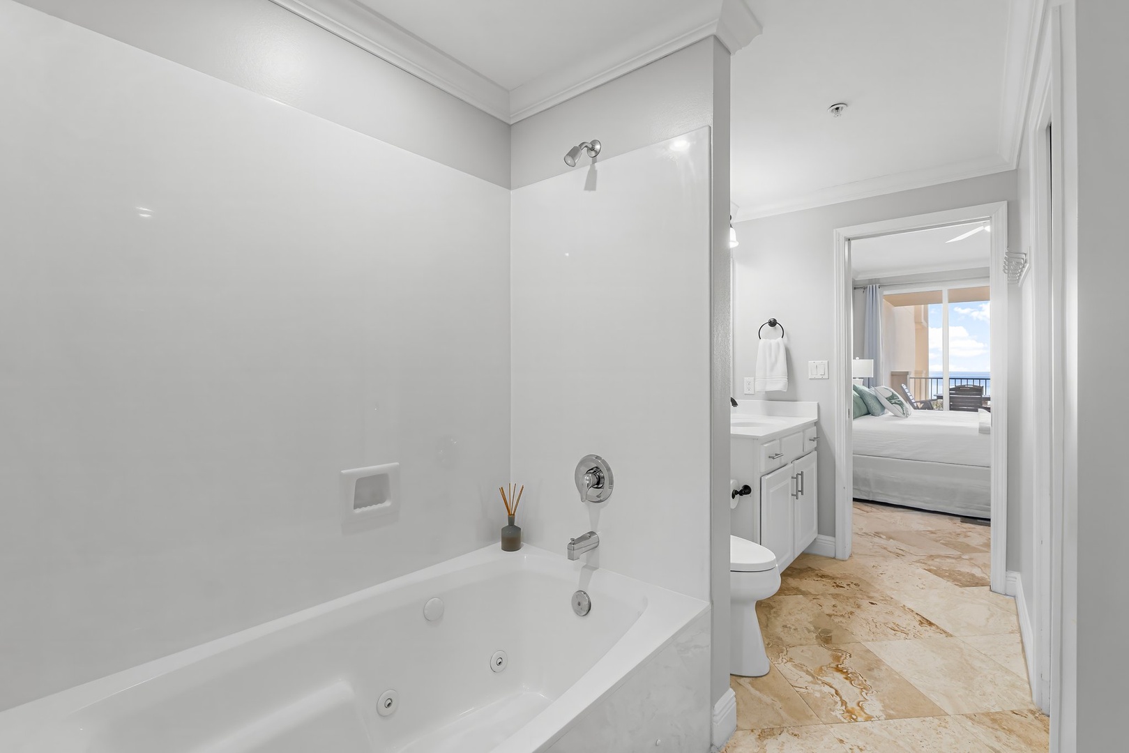 Primary bathroom with shower and tub combo and walk in shower