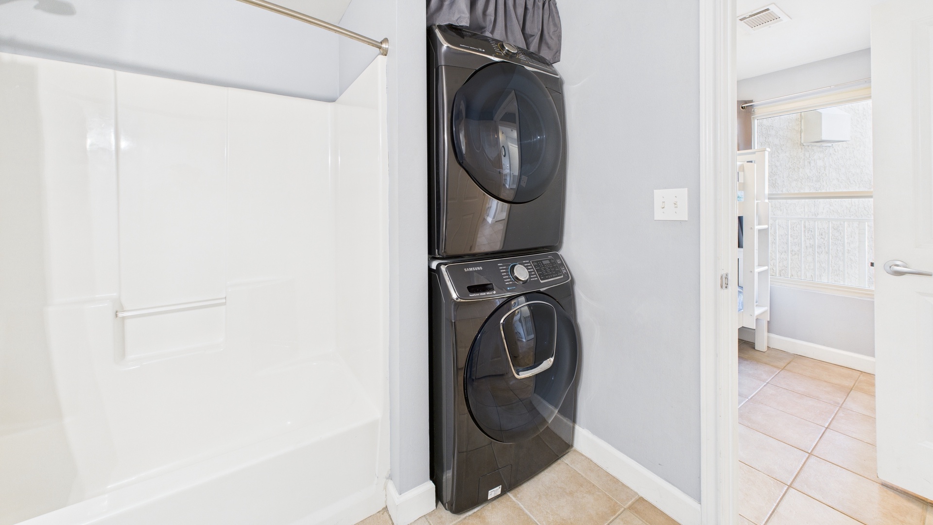 Washer and dryer machines inside guest bathroom