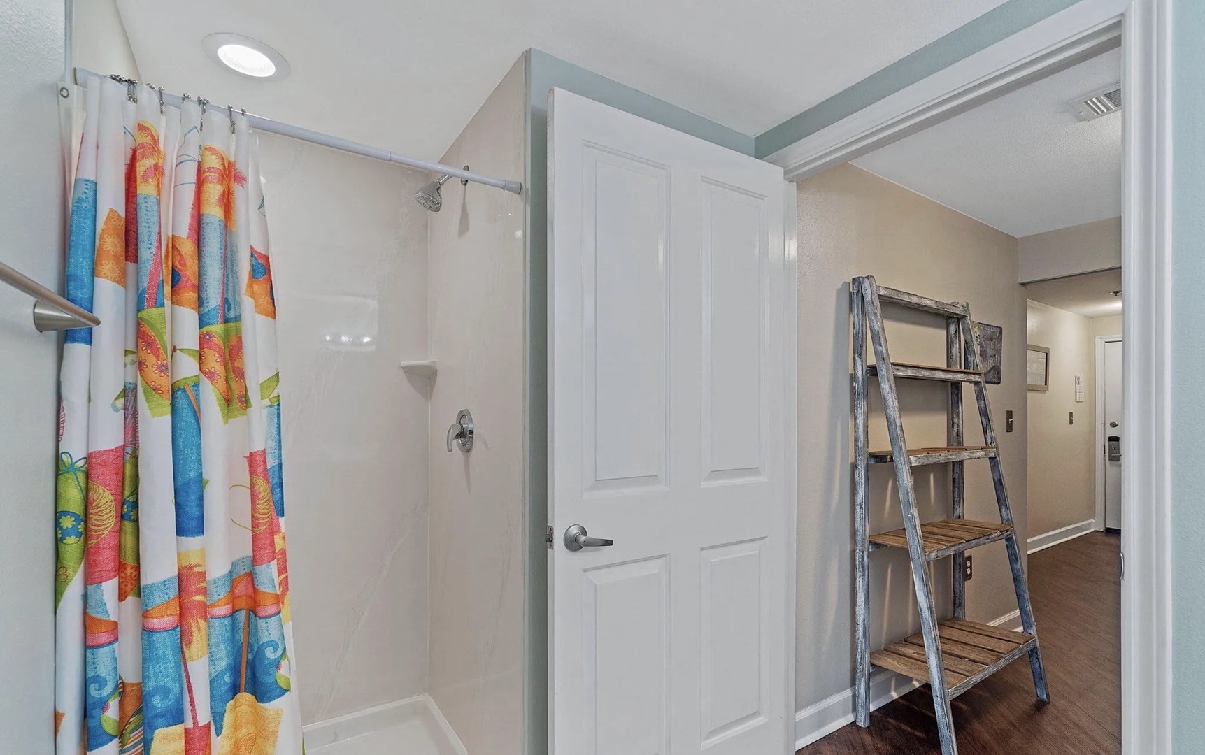 Third bathroom with shower and tub combo.