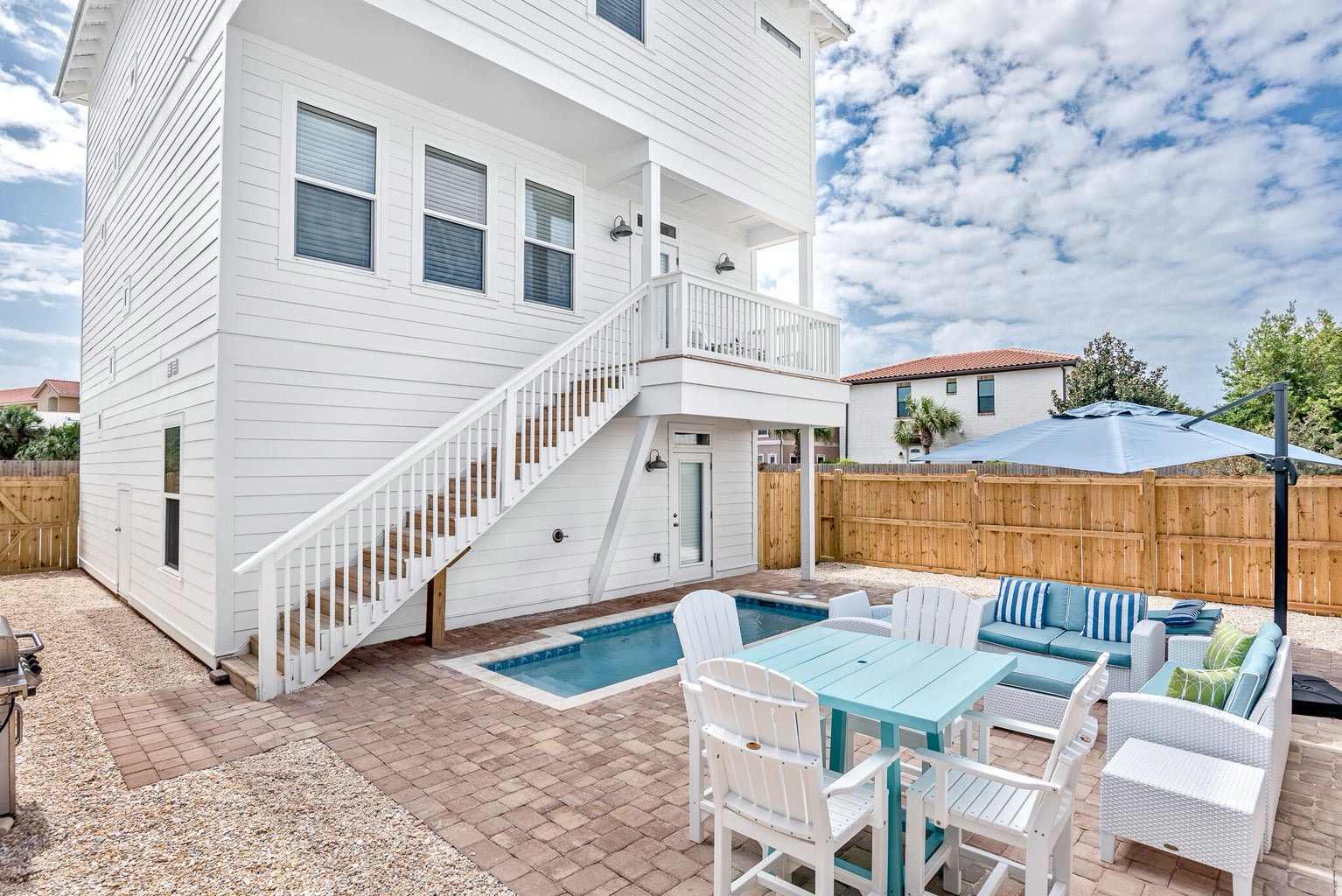 Fenced in backyard with private pool and ample seating