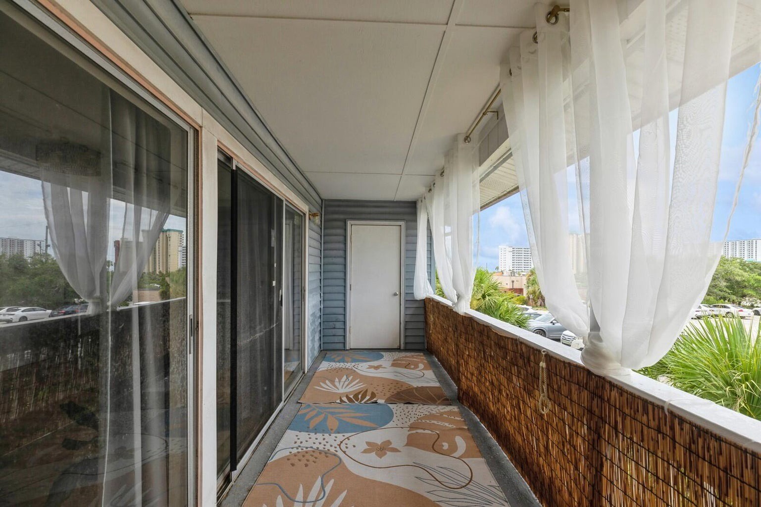 Private balcony with seating and blinds