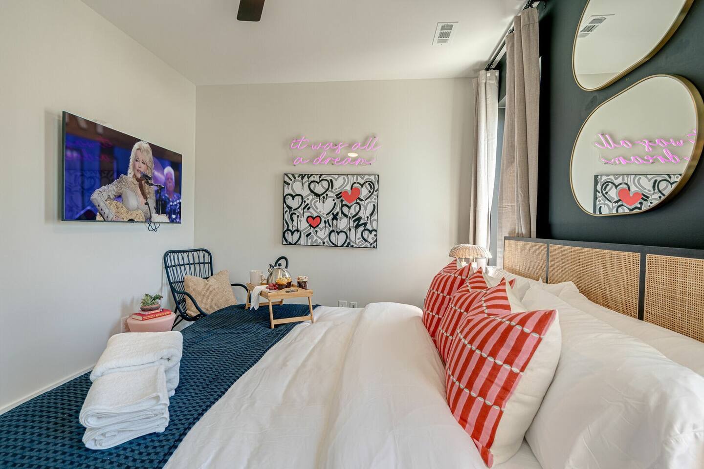 5629 - Primary bedroom with King bed, designer furnishings, smart TV, and ensuite bathroom.