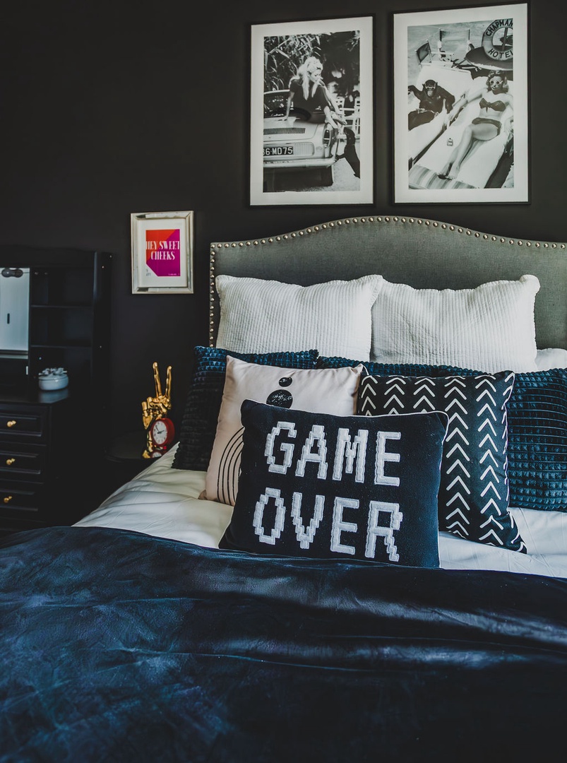 First bedroom with queen bed TV and ensuite bathroom