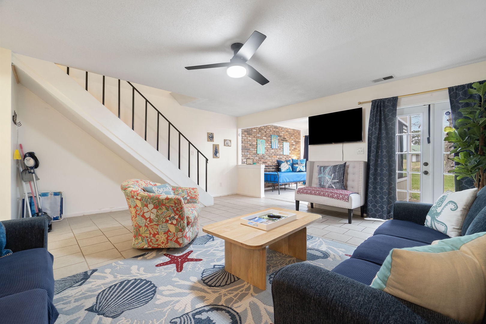 Open concept living area with TV