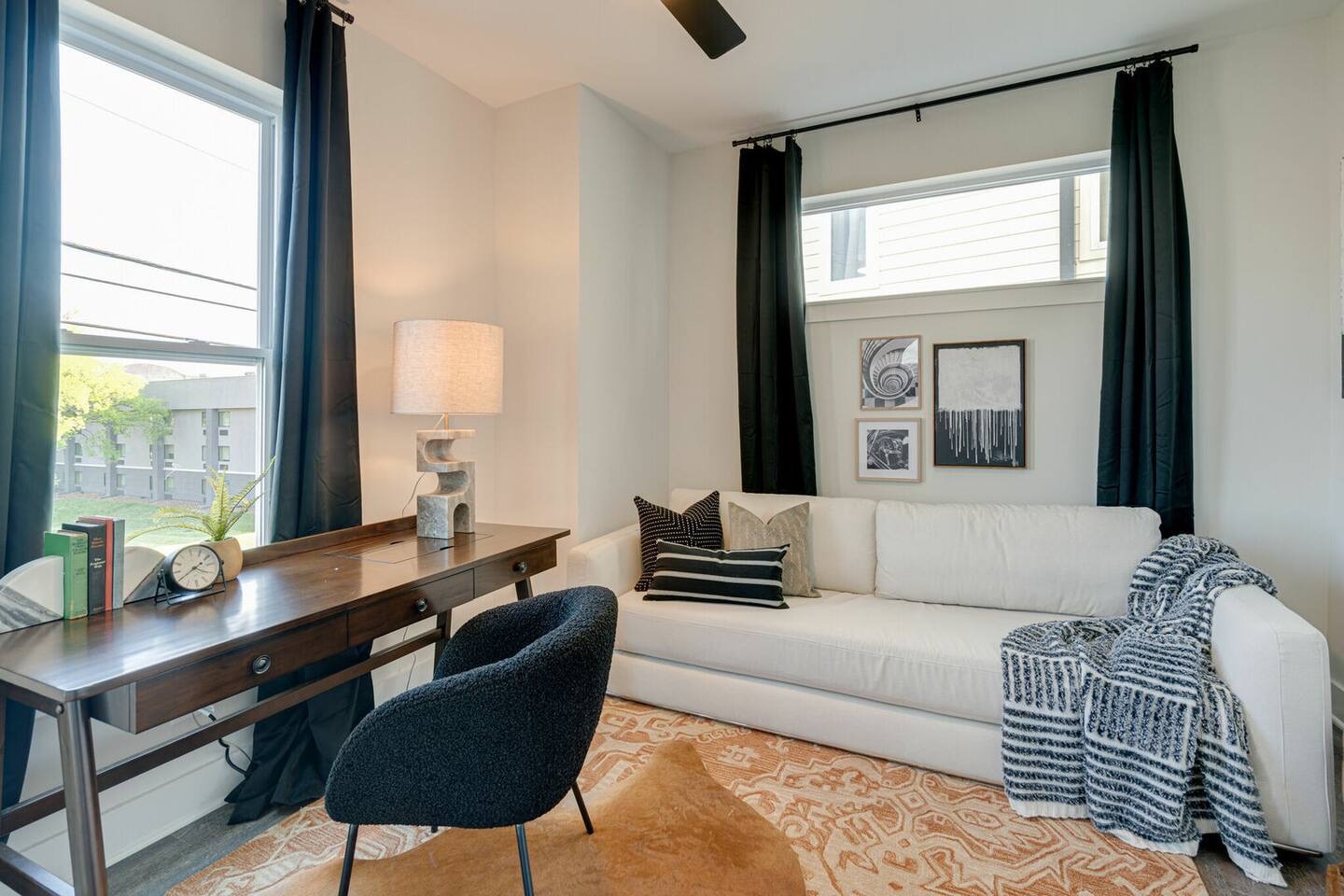 5627 - Common space with desk for work and fold out queen sleeper sofa.
