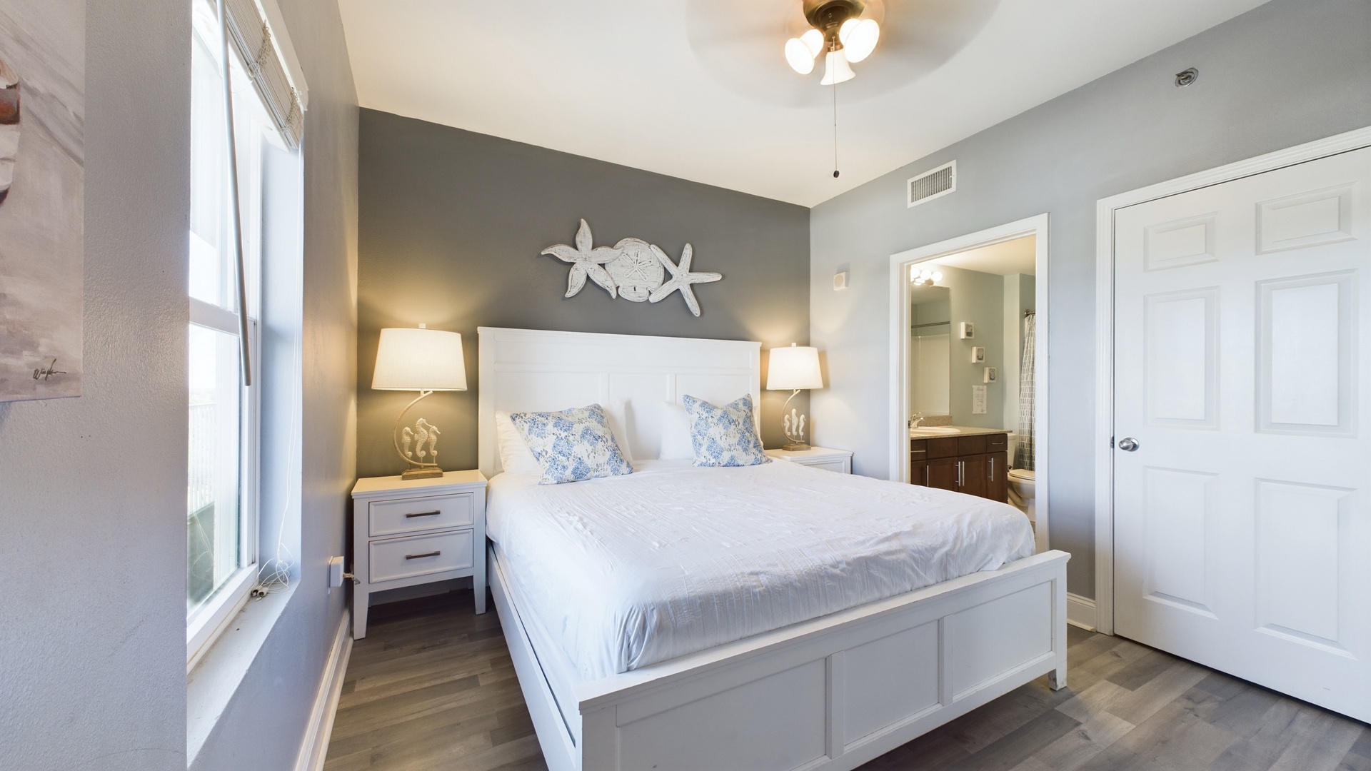 Primary bedroom with king bed and ensuite bathroom