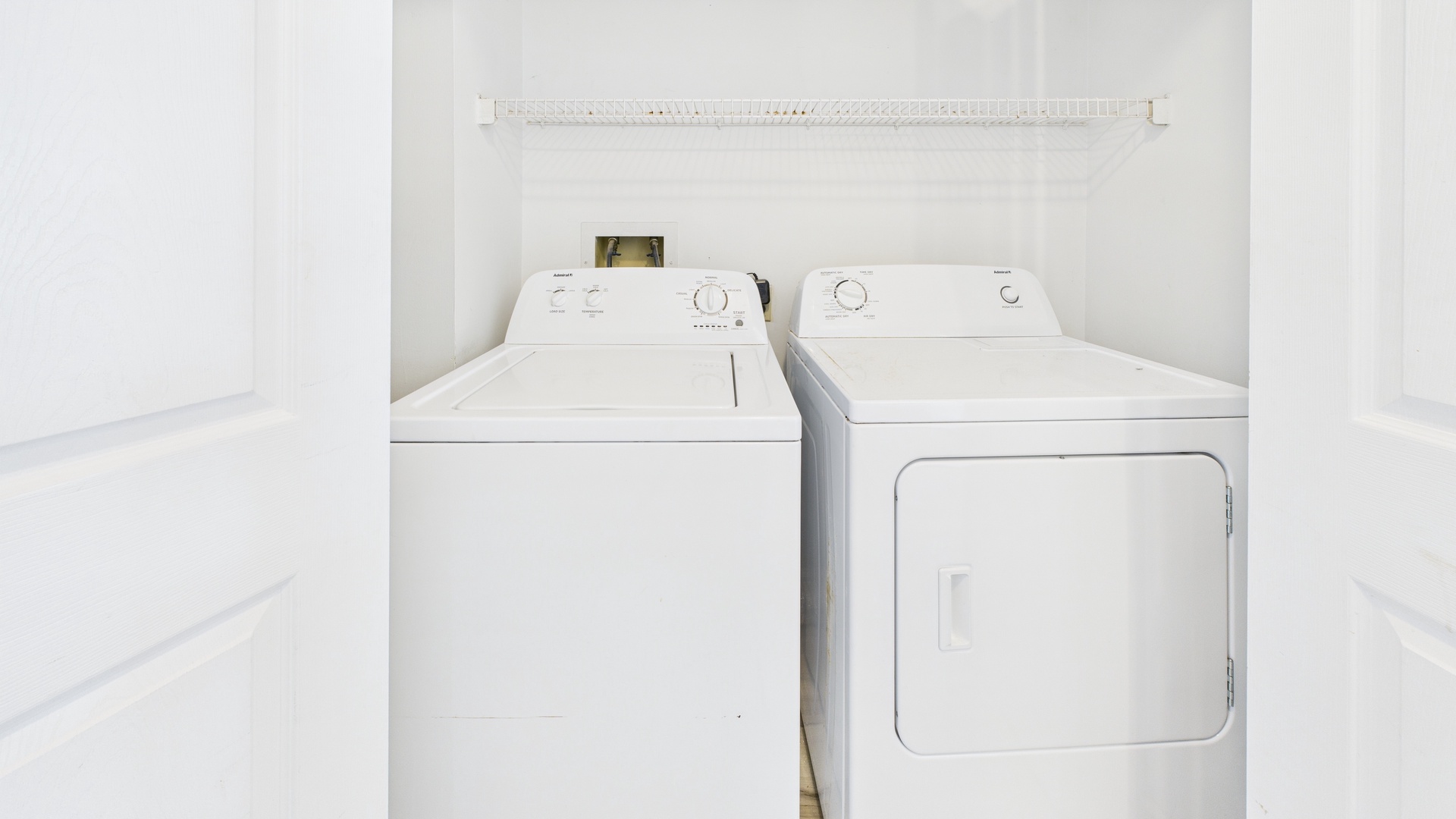 Laundry room with washer and dryer machines