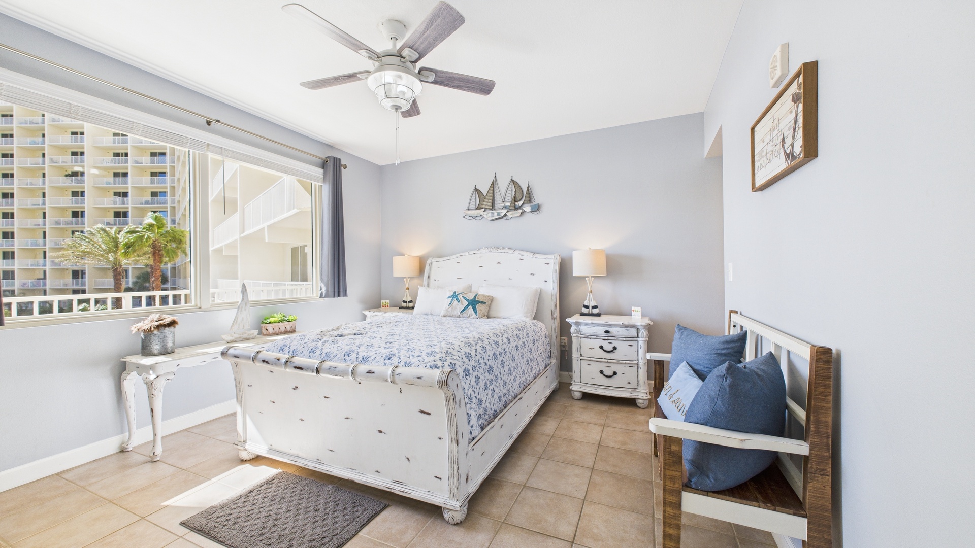 Master bedroom with queen bed TV and ensuite bathroom