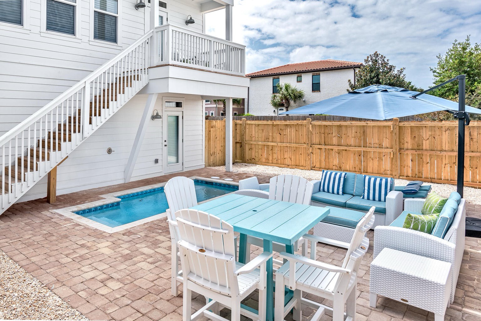 Fenced in backyard with private pool and ample seating