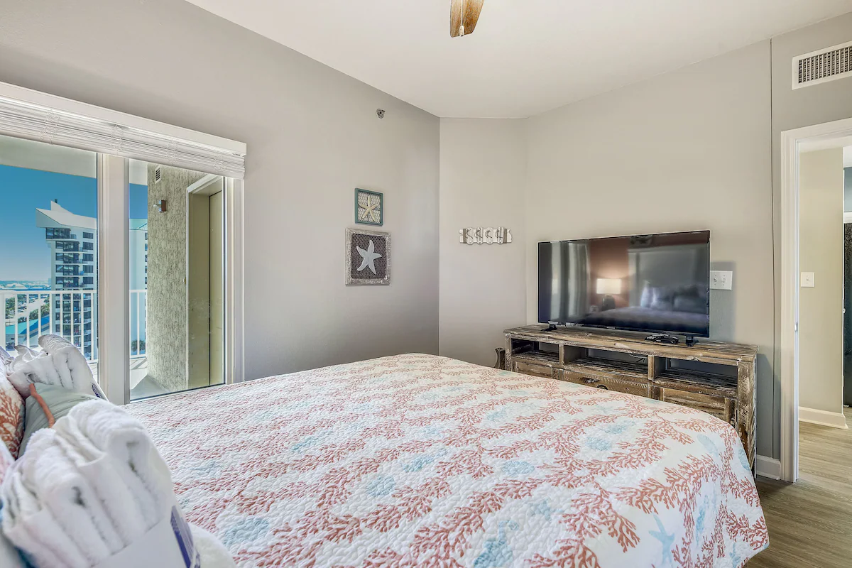 Second guest bedroom with queen bed TV and ensuite bathroom