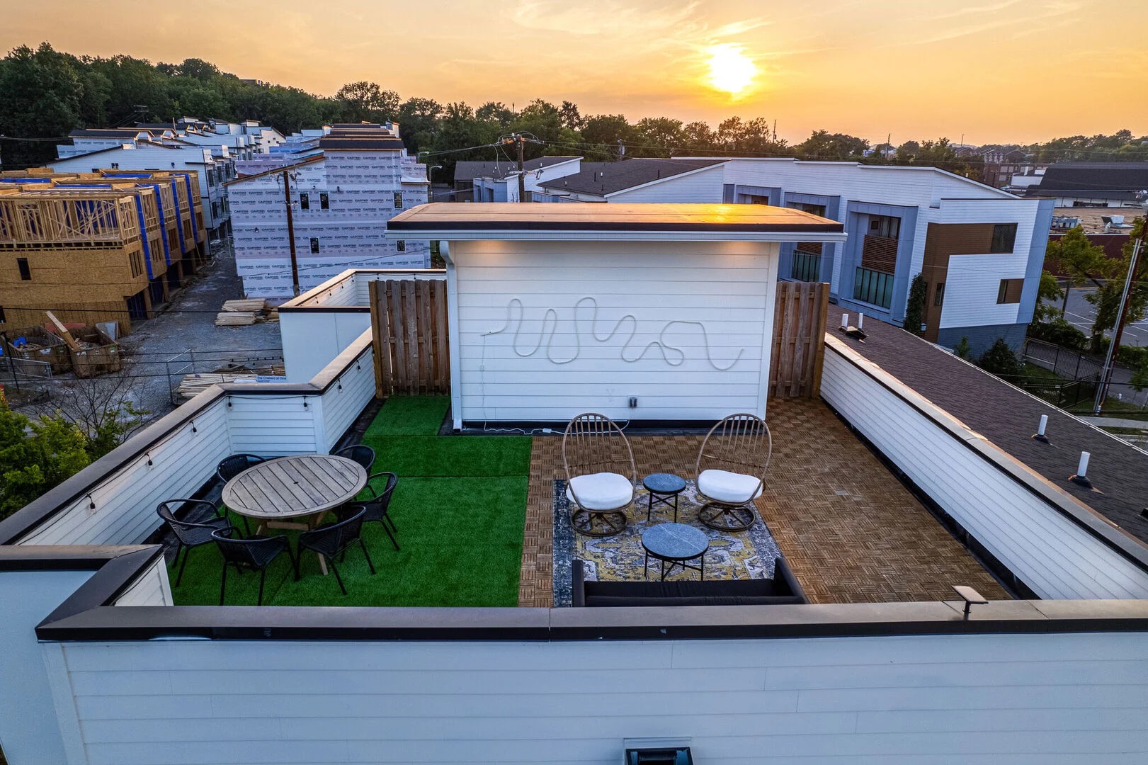 Private rooftop deck with ample seating and dining area
