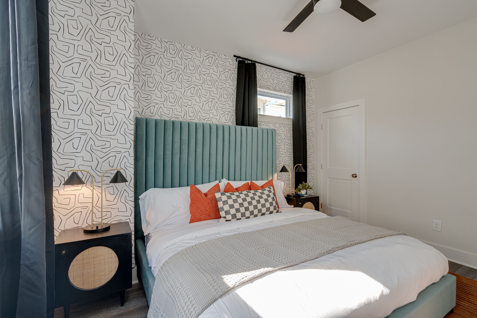 3rd bedroom with King bed, designer furnishings, and closet. Bathroom is adjacent to this room.