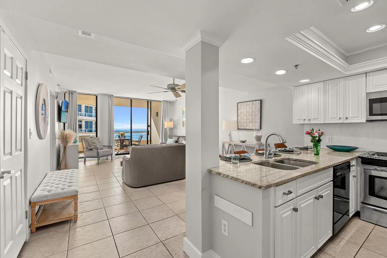 Full kitchen leading into living room