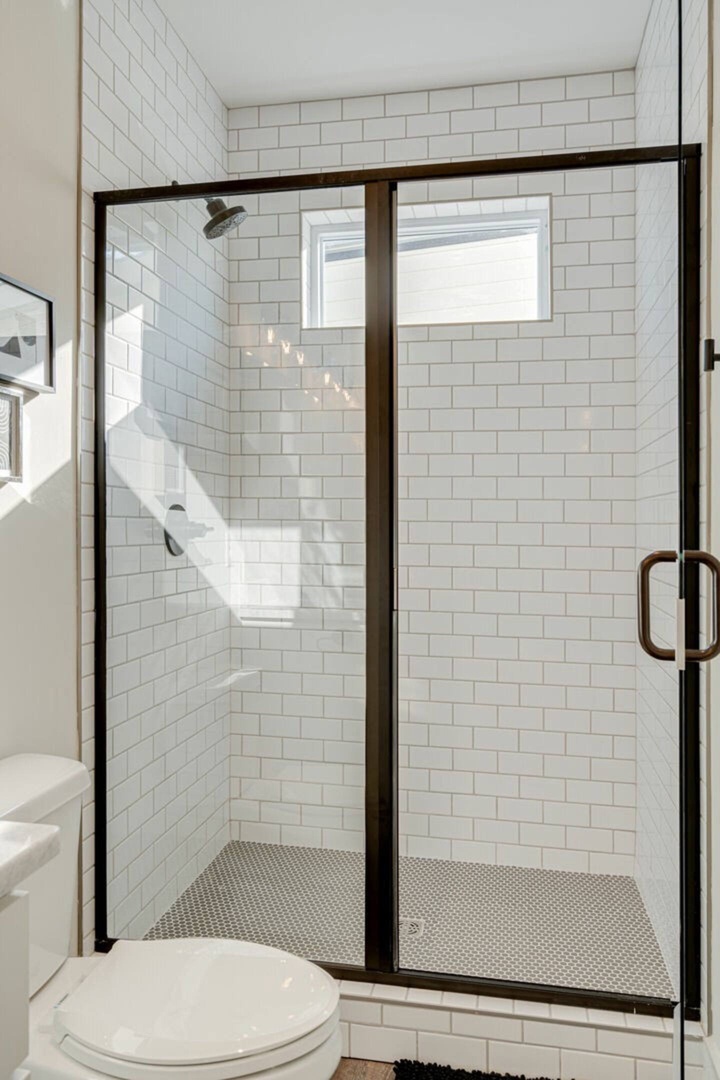 5627 - Primary bathroom with stand in shower and dual vanity