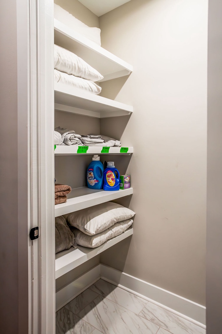Laundry room with ironing tools and washer/dryer machines
