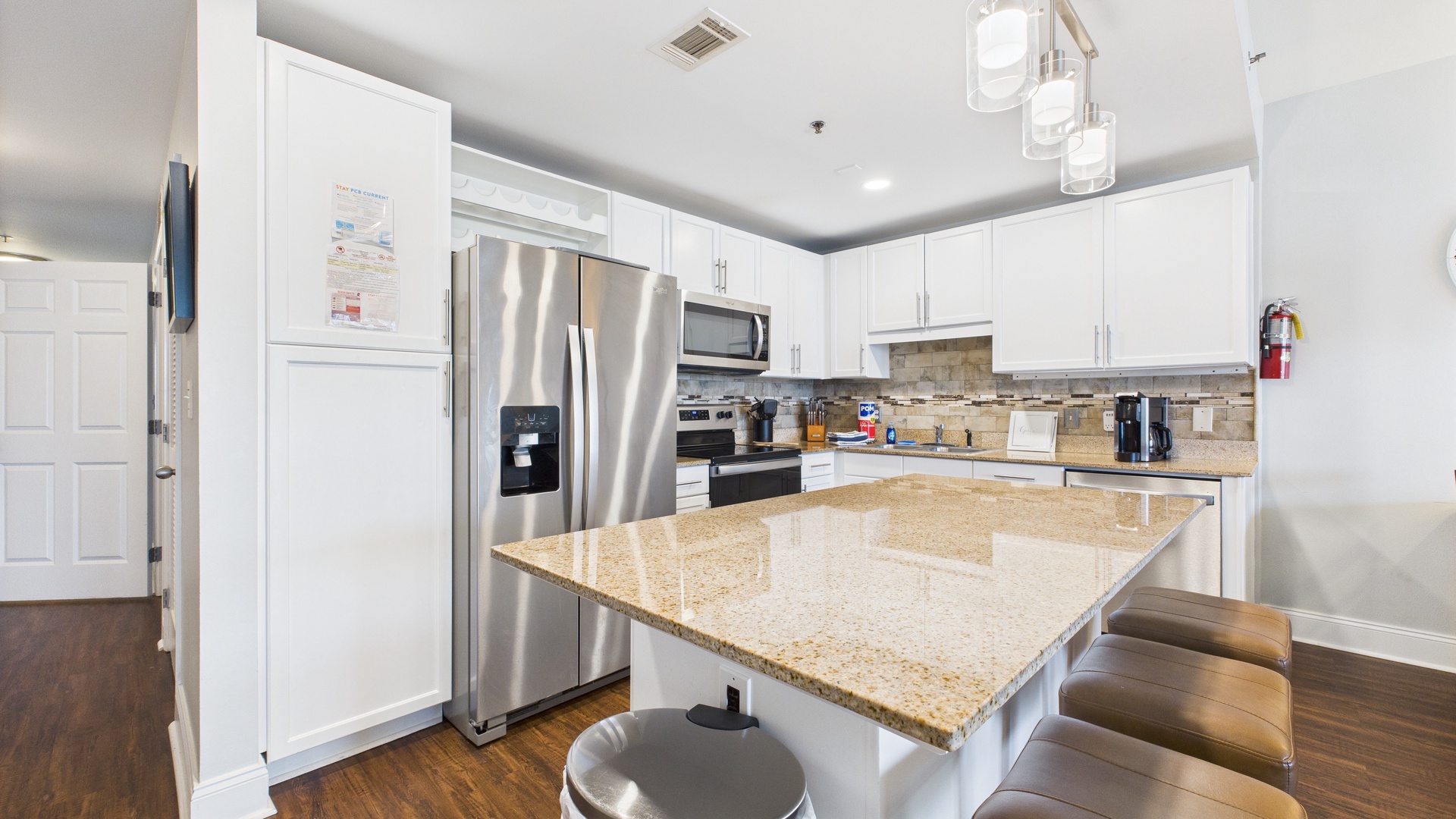 Full kitchen with breakfast bar and island