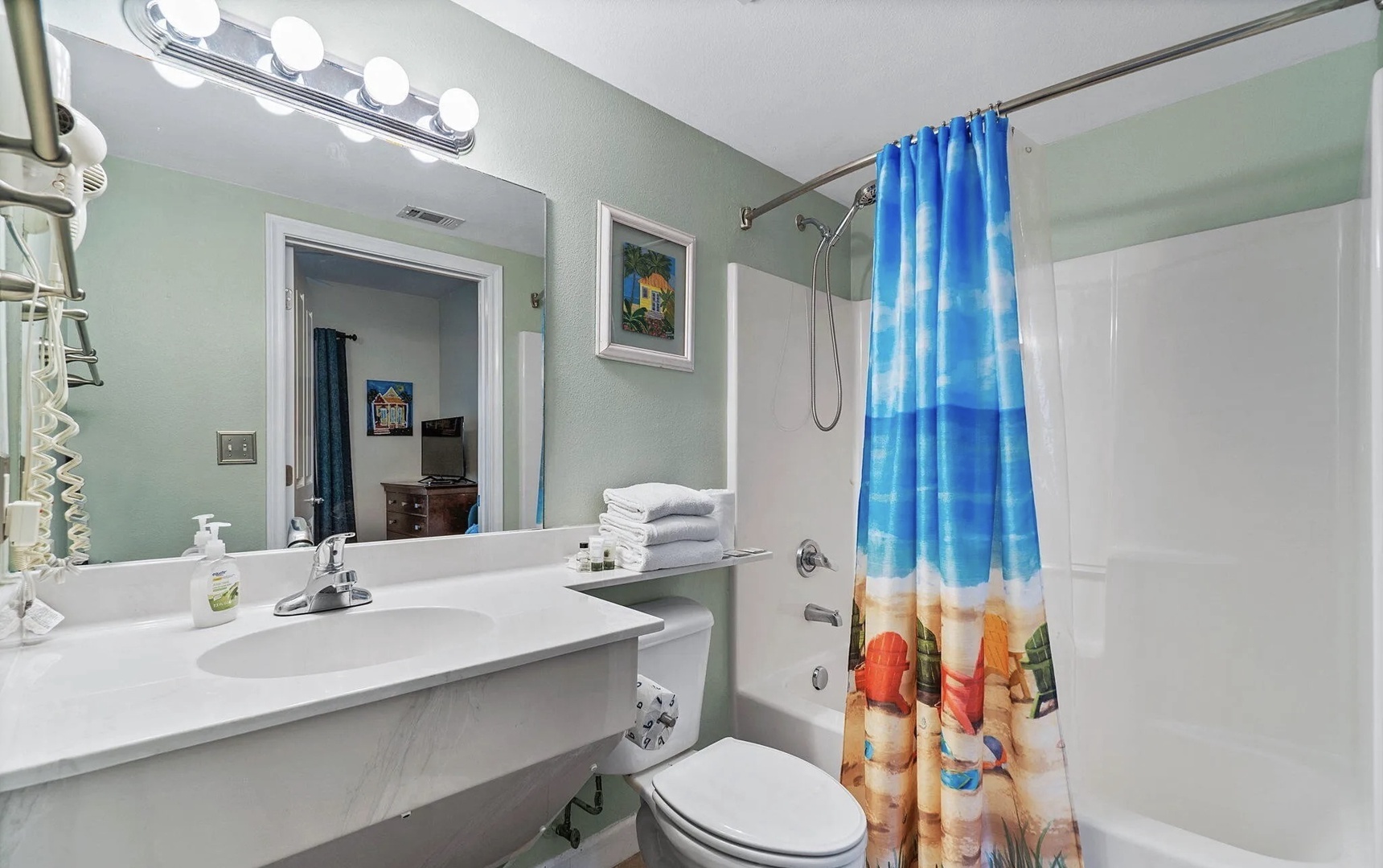 Second bathroom with shower and tub combo.