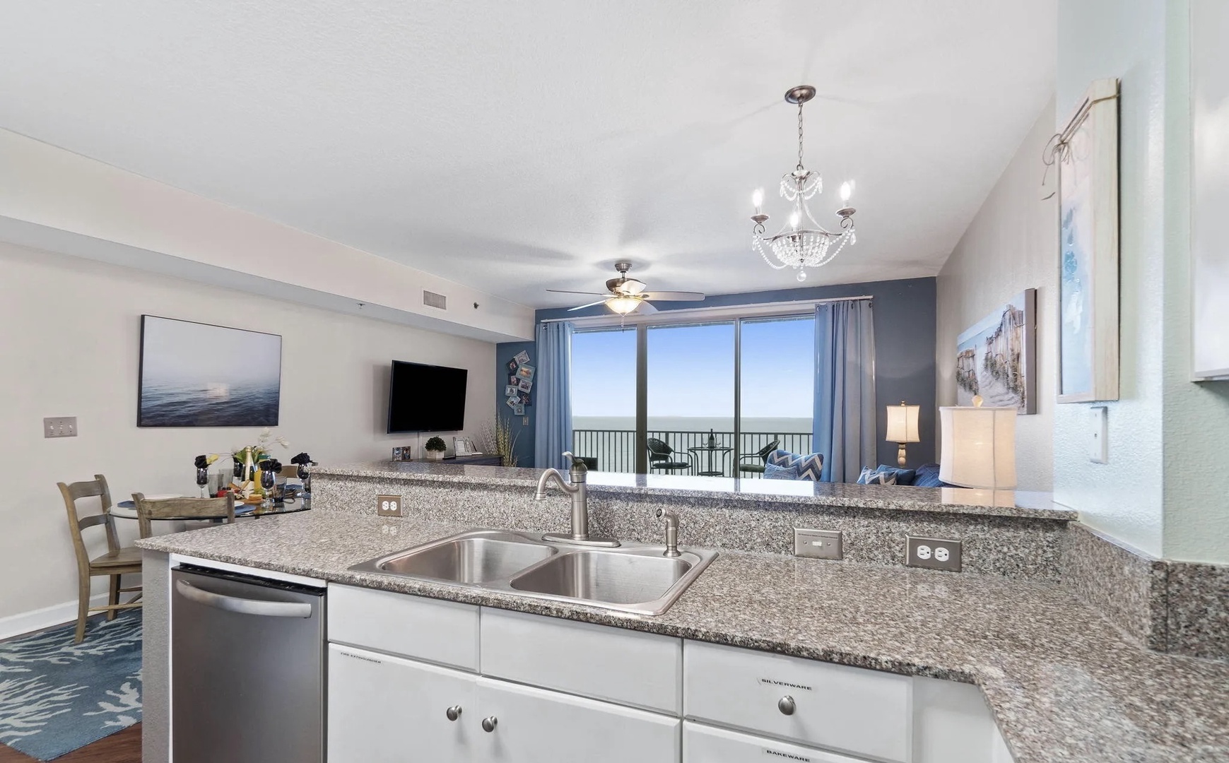 Full kitchen with stainless steel appliances and equipped with basic cooking essentials.