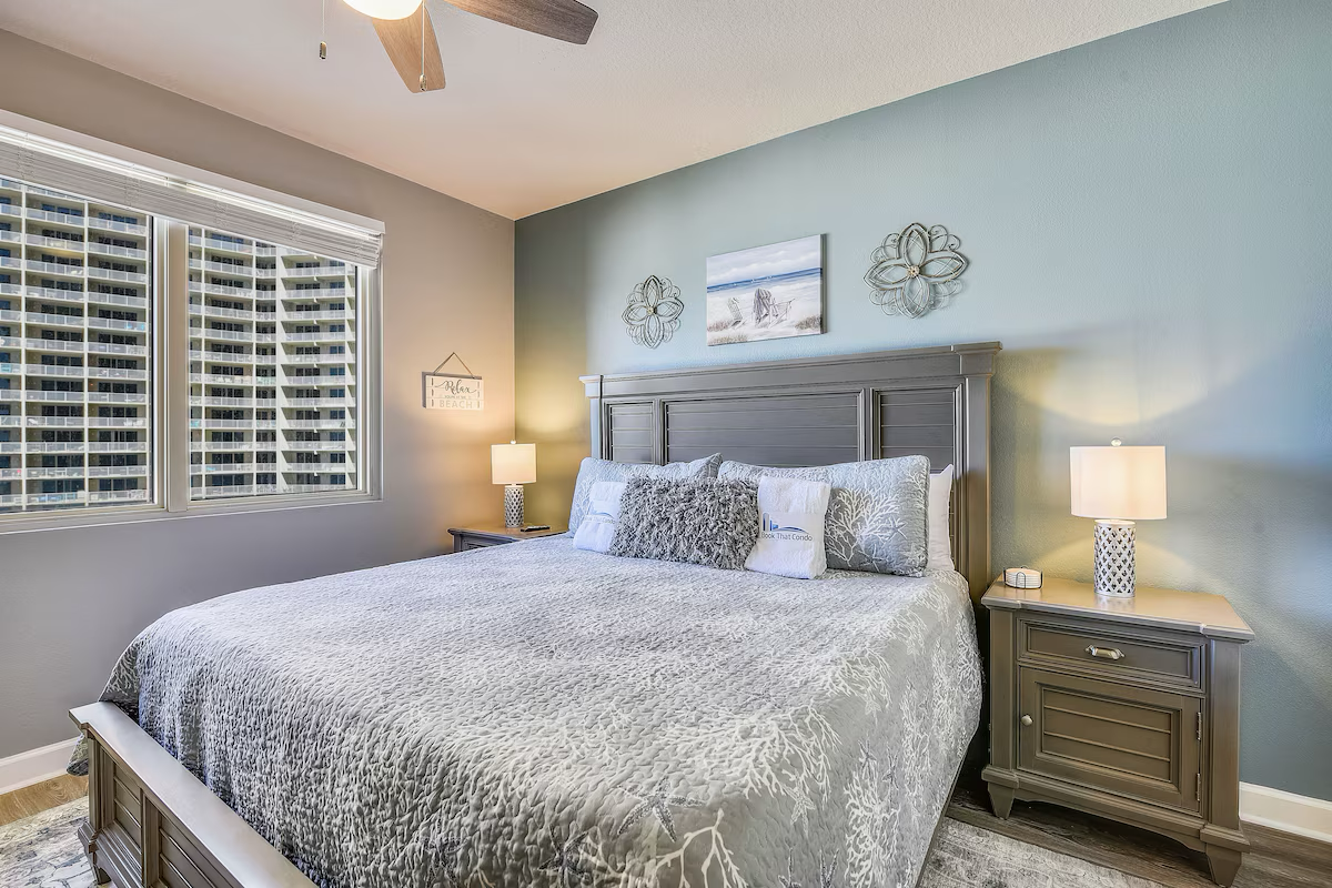 Primary bedroom with king bed TV and ensuite bathroom
