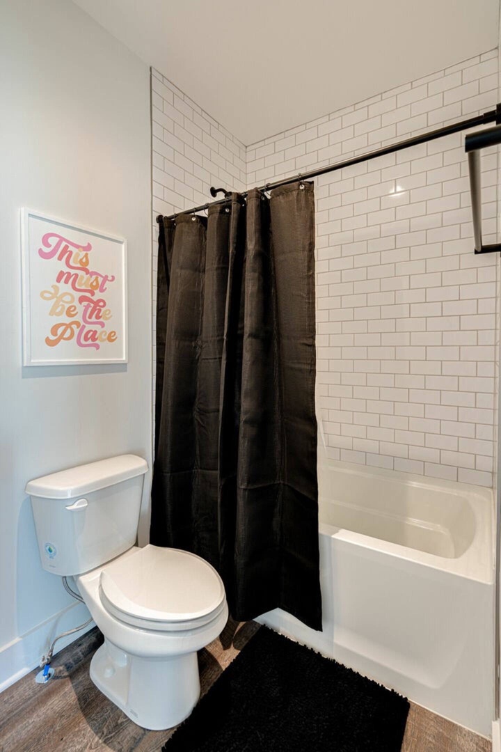 5629 - Primary bathroom with a shower and tub combo.