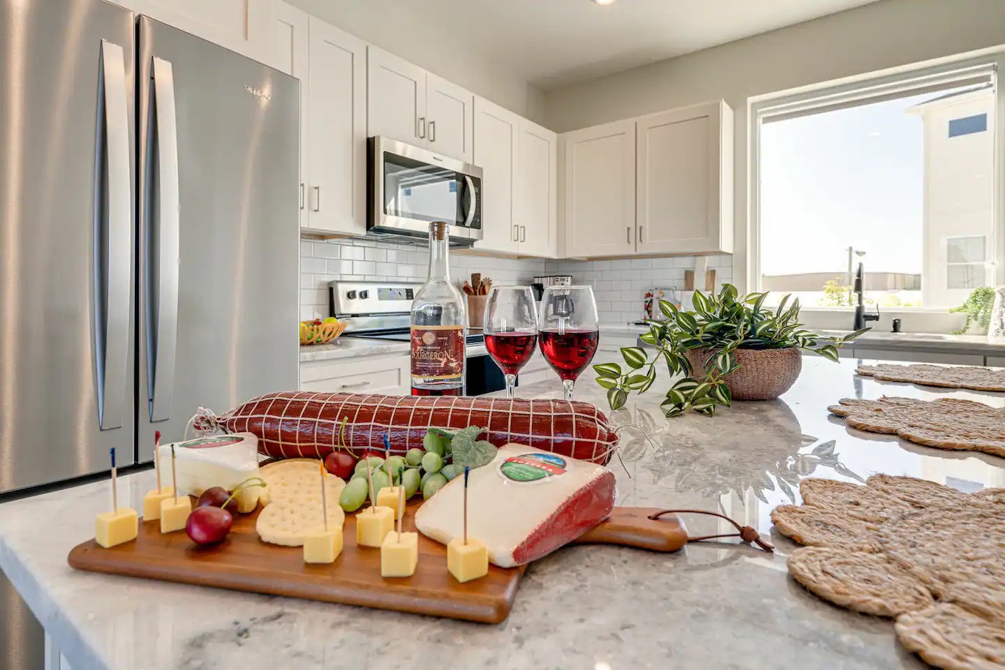 5629 - Open kitchen with stainless steel appliances, large island, breakfast bar seating, and is fully equipped with your basic cooking essentials.