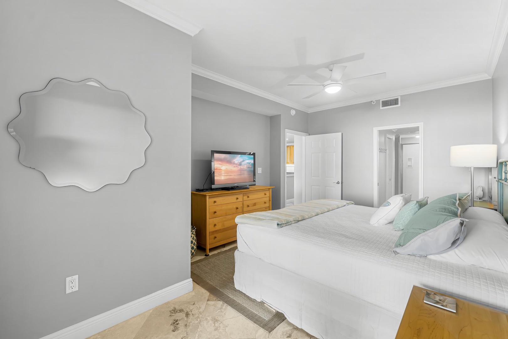 Primary bedroom with king bed and ensuite bathroom
