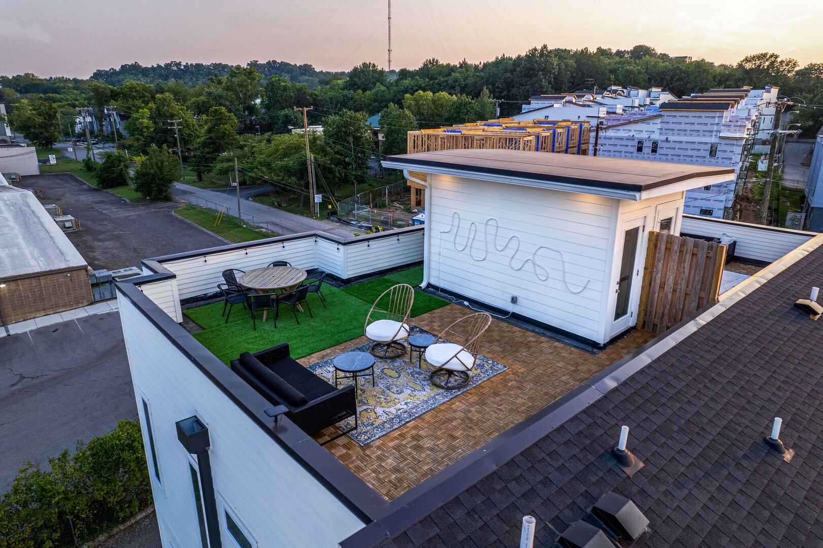 Private rooftop deck with ample seating and dining area