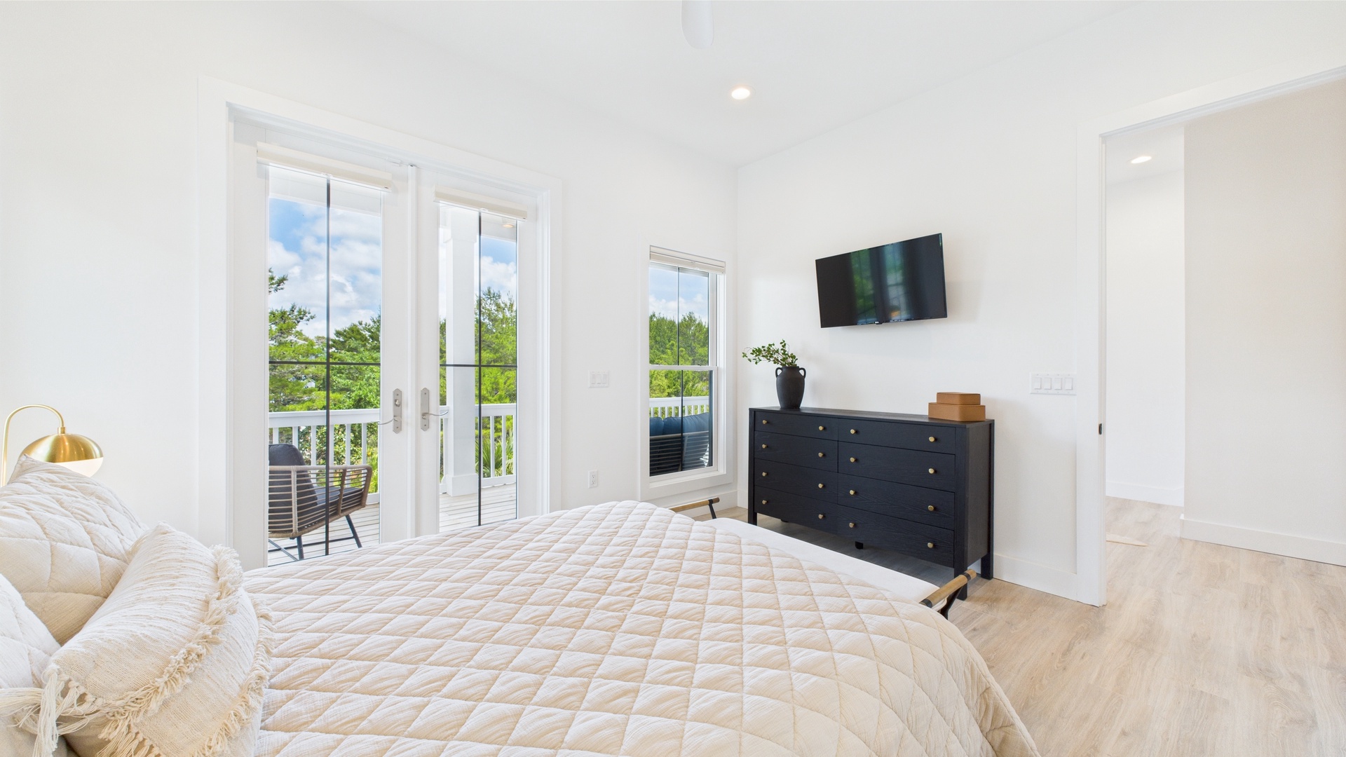 Third bedroom with queen bed TV and shared ensuite bathroom