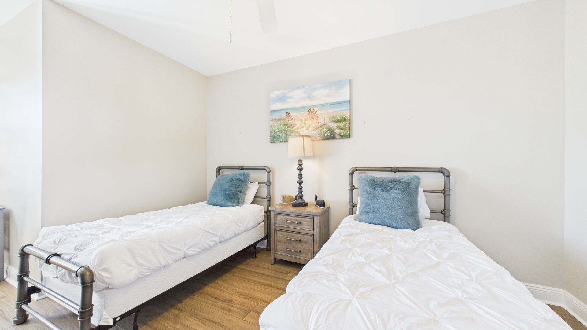 Guest bedroom with two twin beds and desk