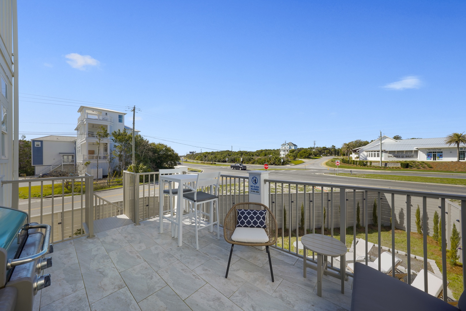 Balcony overlooking the pool area with Grill