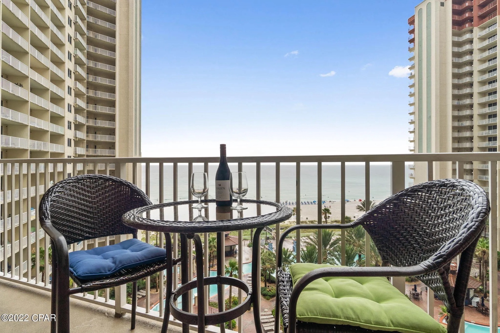 Balcony with comfortable living and dining seating.
