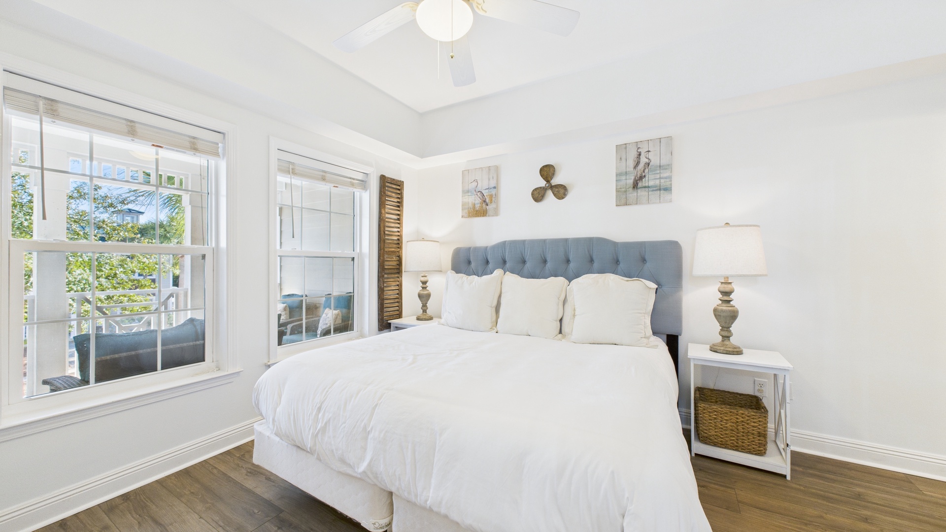 Primary bedroom with king bed TV and ensuite bathroom