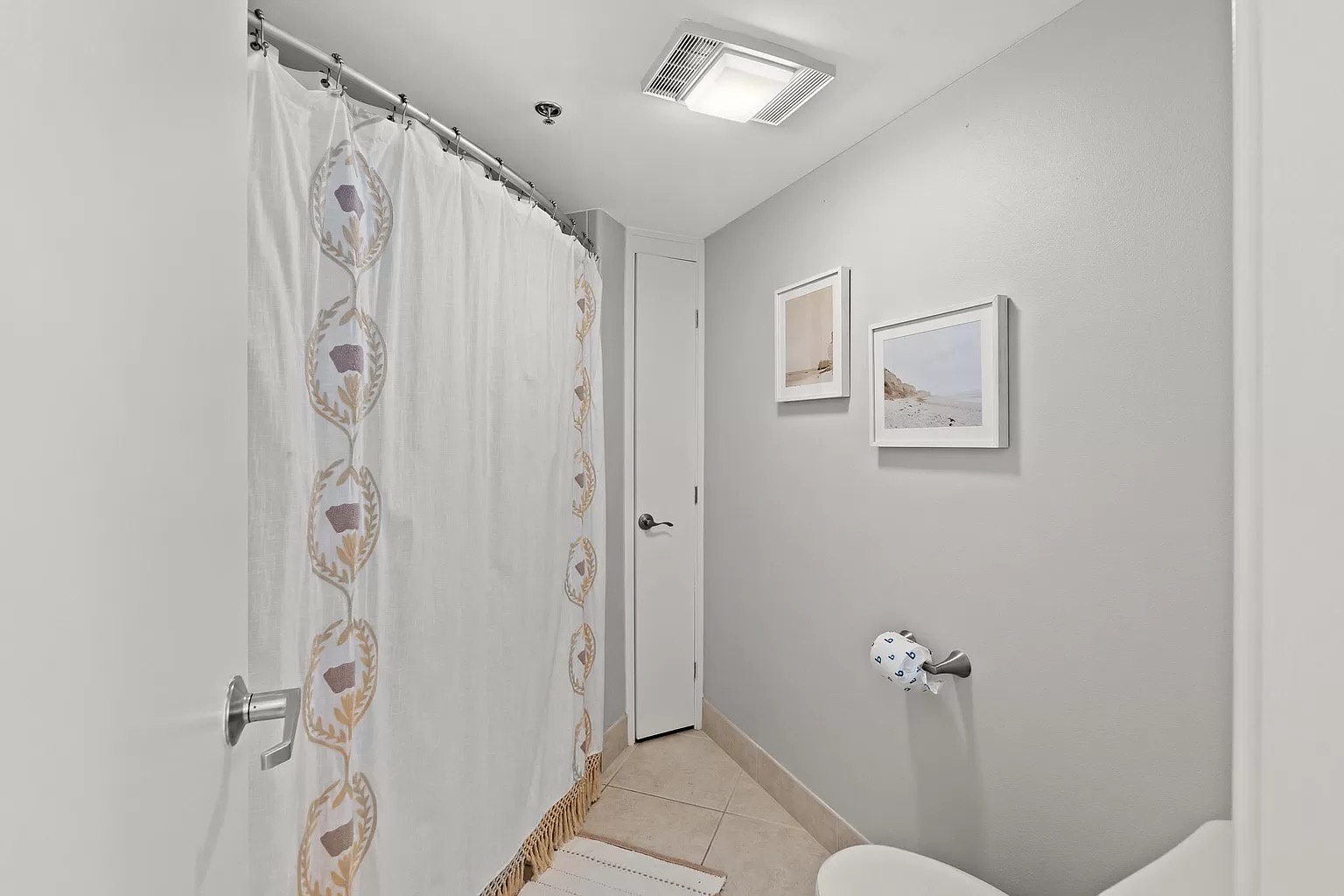 Master bedroom ensuite bathroom with double vanity and shower/tub combo