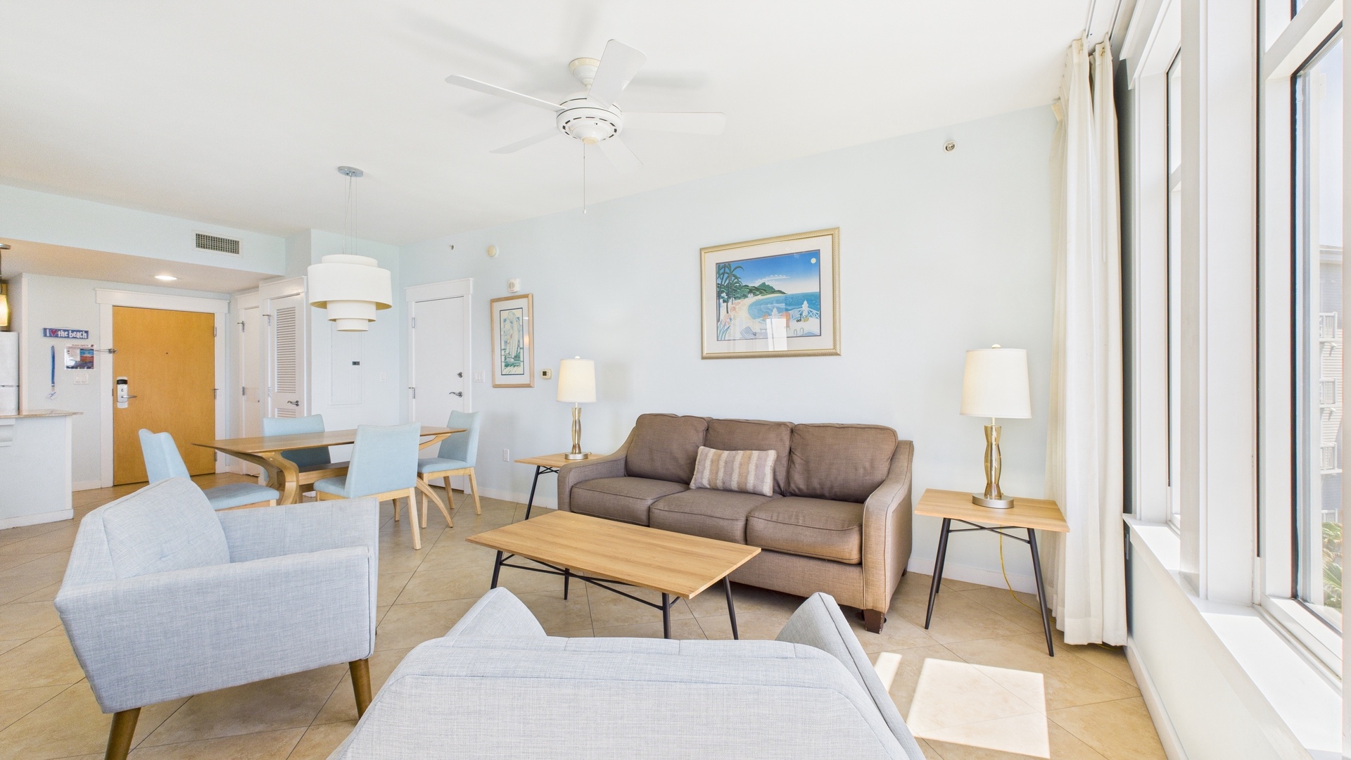Open concept living area with stylish furnishings TV and sofa bed