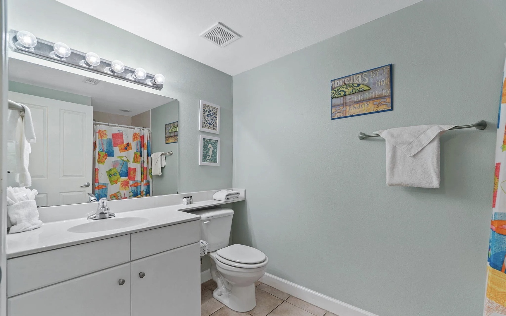 Third bathroom with shower and tub combo.