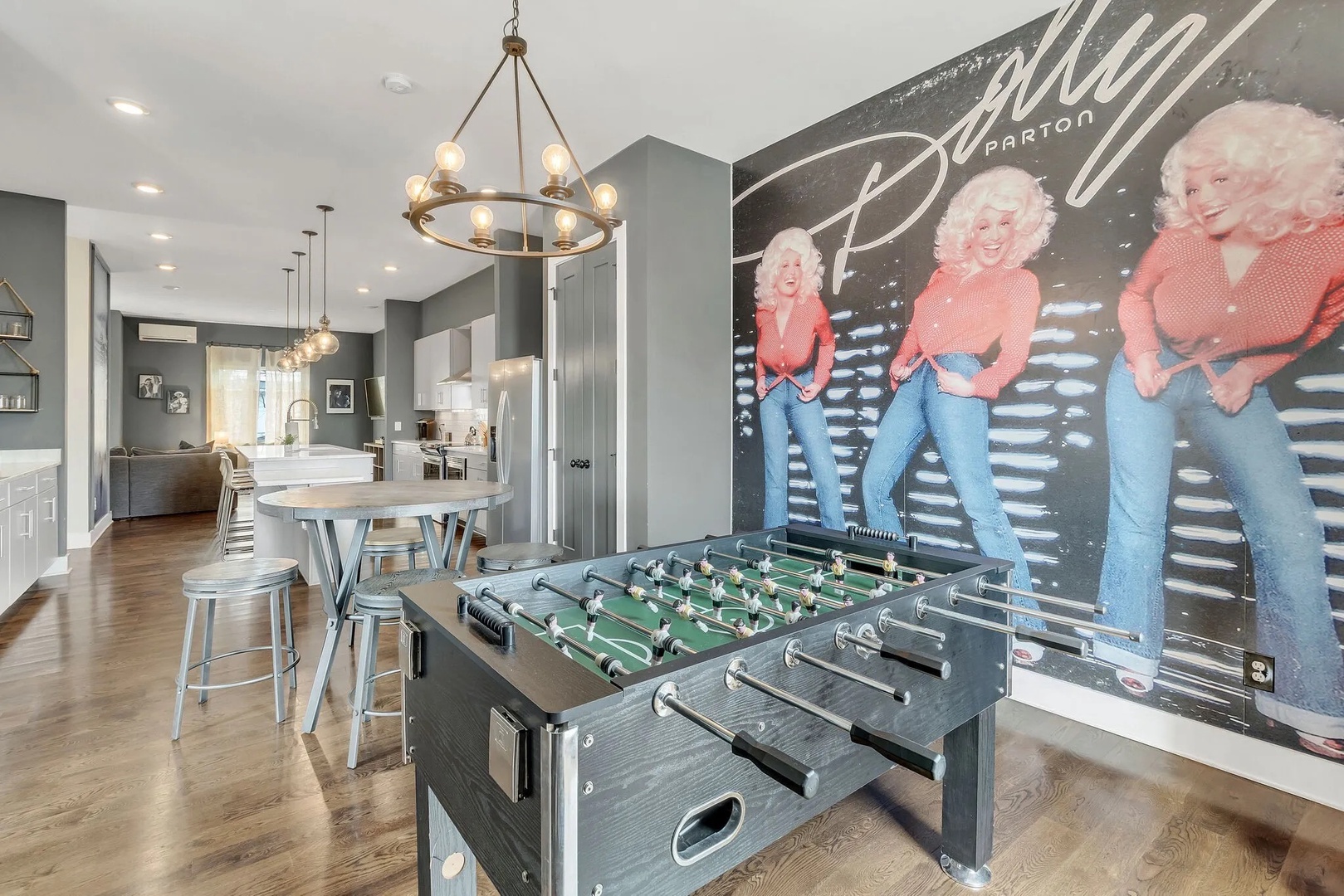Open living and kitchen area with foosball table