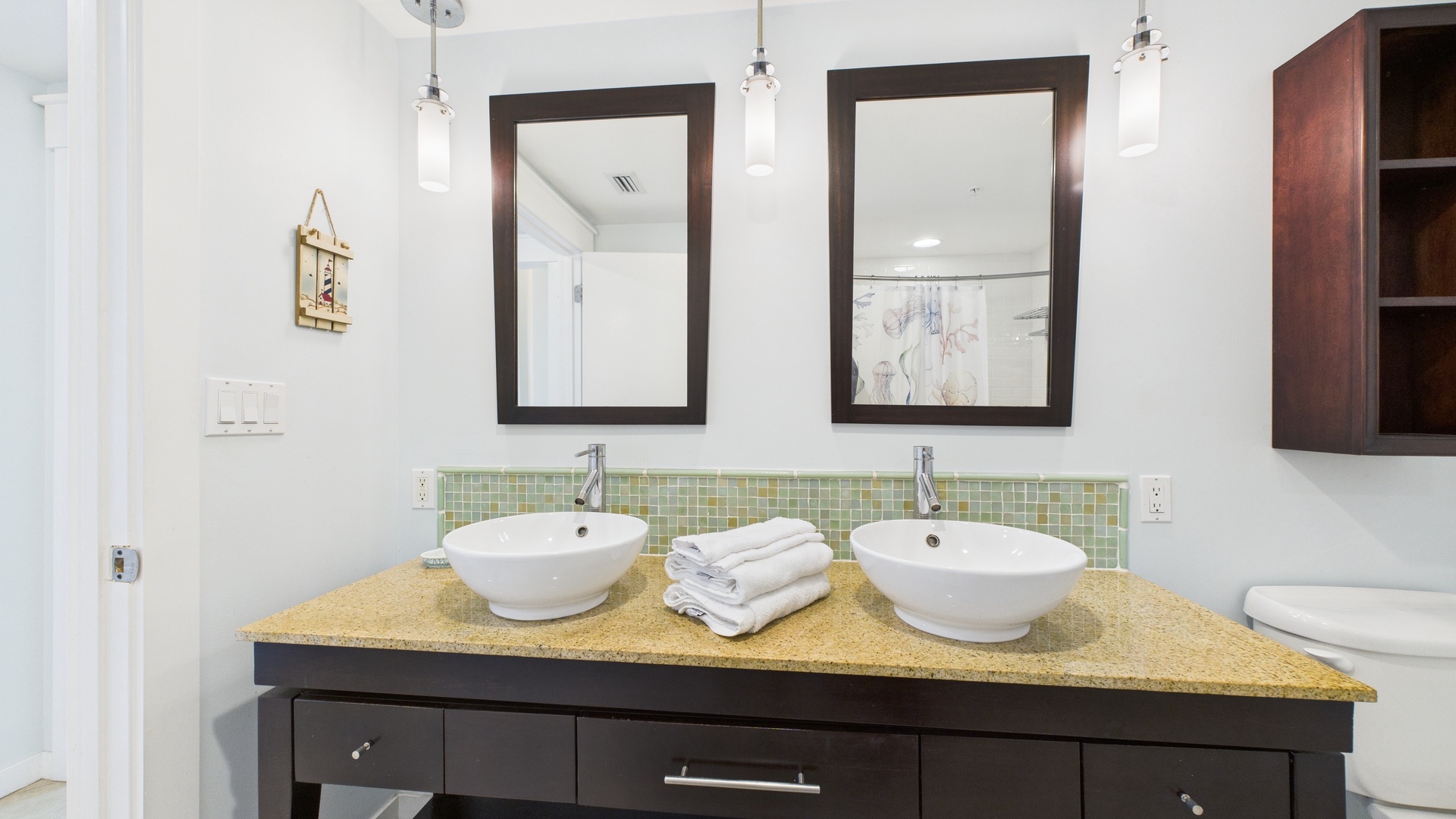 Ensuite master bathroom with dual vanity and shower/tub combo