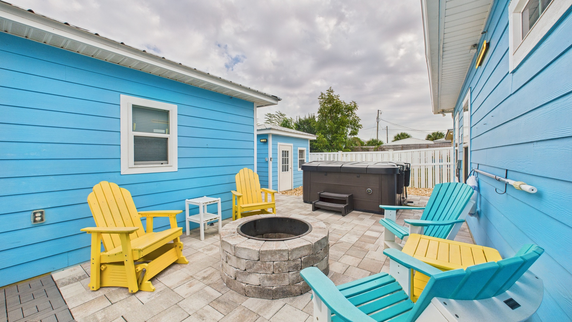 Back patio sitting area with wood burning fire pit