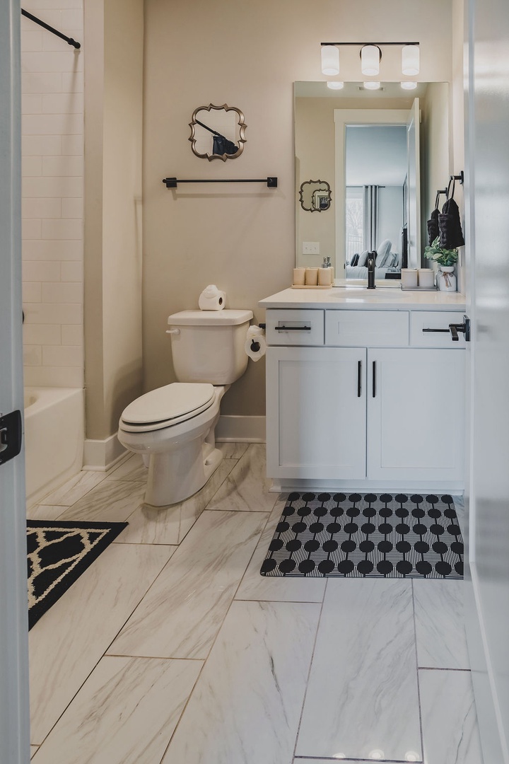 Full bathroom with shower and tub combo
