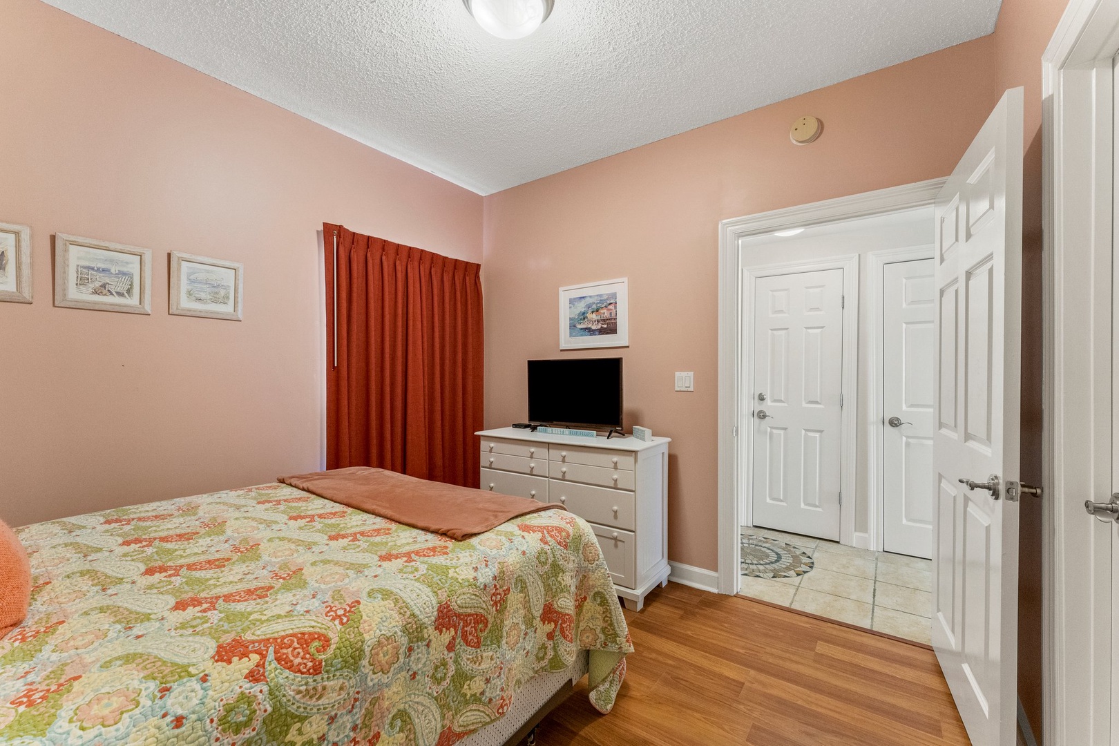 Guest bathroom with queen-sized bed