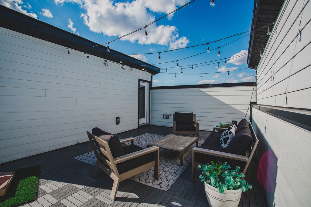 Private rooftop deck with ample seating