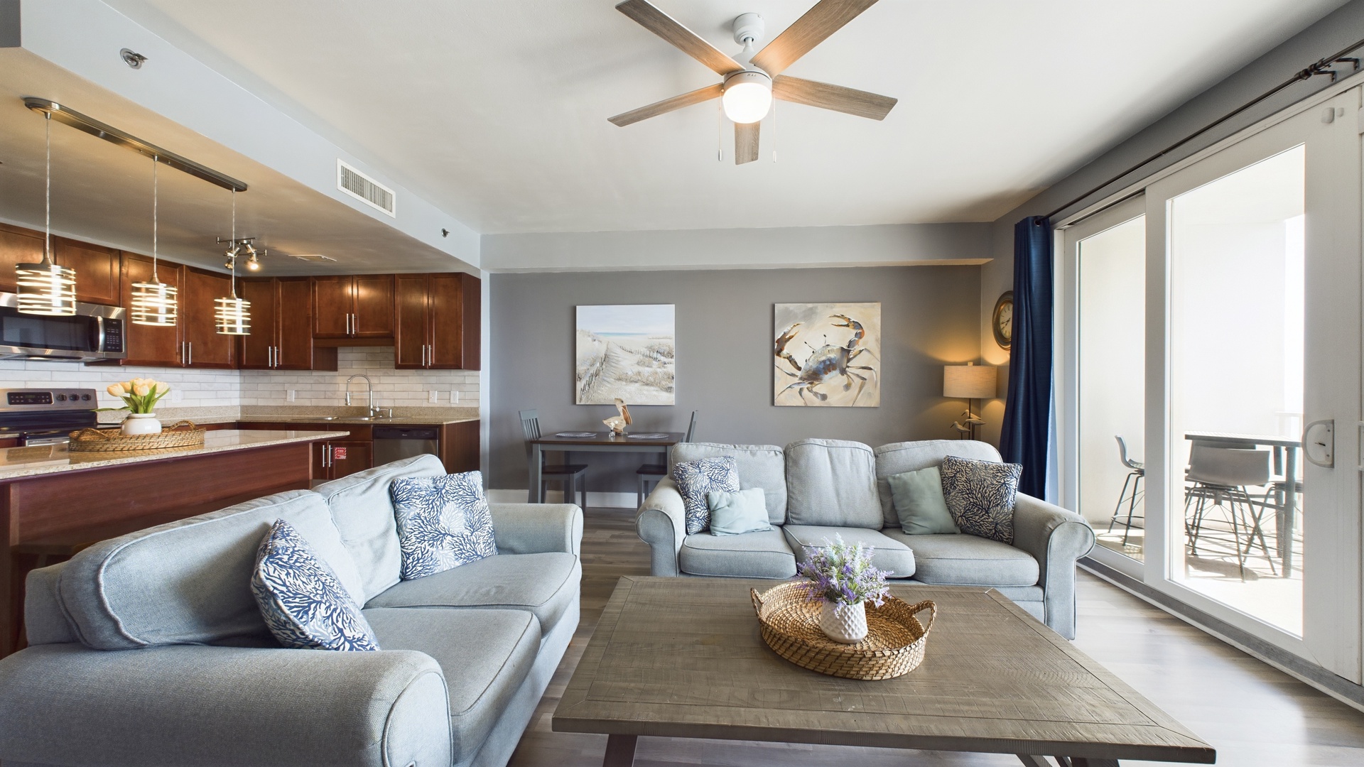 Open concept living area with TV coastal views and sleeper sofa