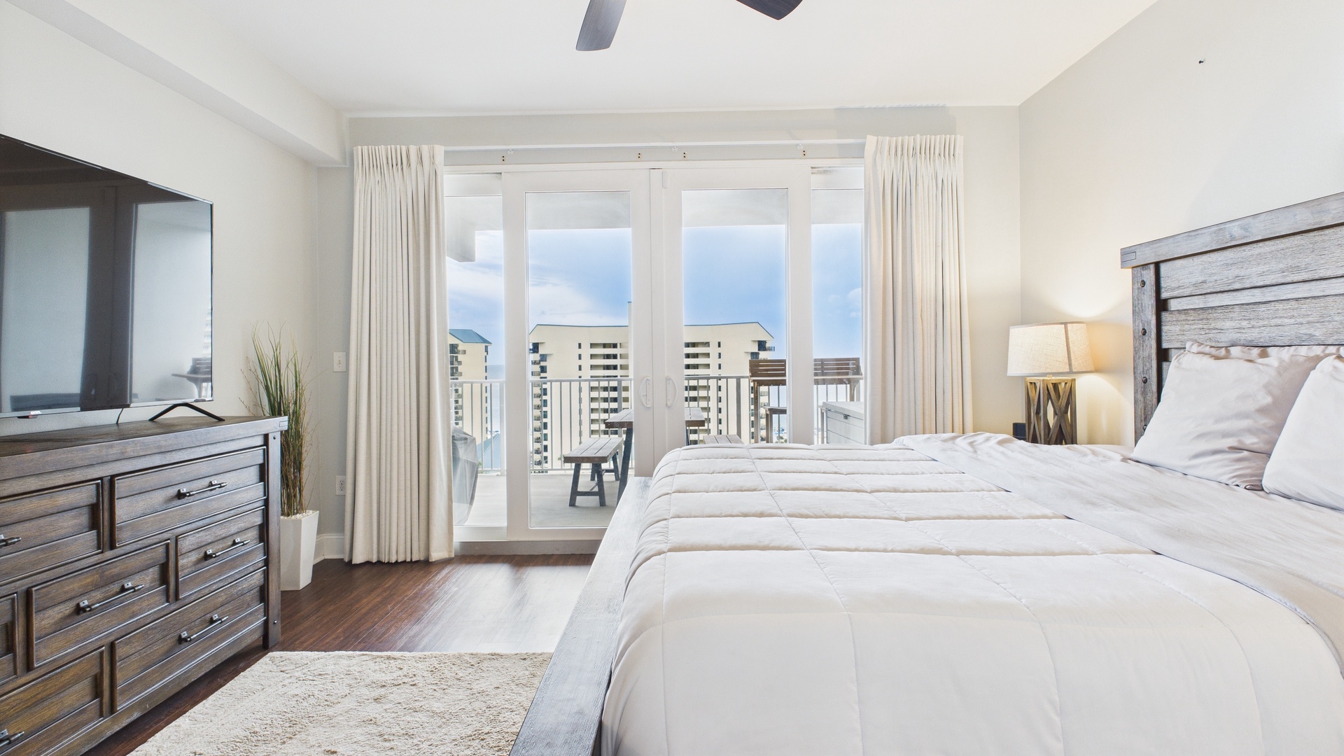 Master bedroom with king bed balcony access and ensuite bathroom (sleeps 2)
